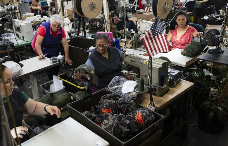 Workers at Unionwear, a hat and bag factory that has been churning out about 5,000 hats per day for the Harris-Walz presidential campaign, in Newark, N.J., Sept. 10, 2024. The business, one of the last remaining union-run hat factories in the U.S., has made them for competing political campaigns for more than 3 decades. (James Estrin/The New York Times) 