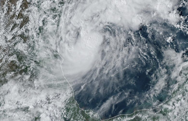 This GOES-16 GeoColor satellite image taken at 4:50 p.m. EDT and provided by National Oceanic and Atmospheric Administration (NOAA) shows Tropical Storm Milton, center, off the coast of Mexico in the Gulf of Mexico, Saturday, Oct. 5, 2024. (NOAA via AP) NYDD221 NYDD221