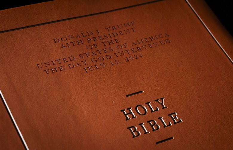 The front cover of Republican presidential nominee former President Donald Trump’s “God Bless the USA” Bible in Washington, Tuesday, Oct. 8, 2024. (AP Photo/Ben Curtis) 