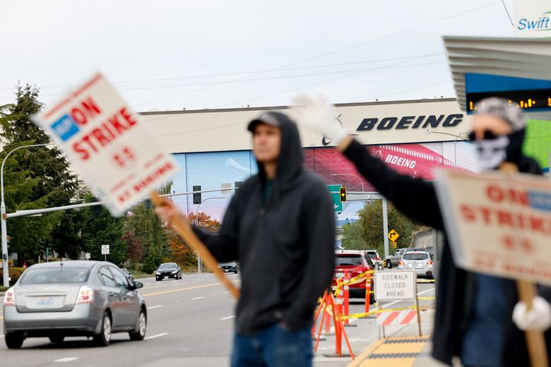 Picketers outside Everett&#8217;s Boeing plant. Friday, Oct. 11, 2024. Boeing will lay off 10% of workforce and stop 767 commercial production as the strike drags on. (Karen Ducey / The Seattle Times)