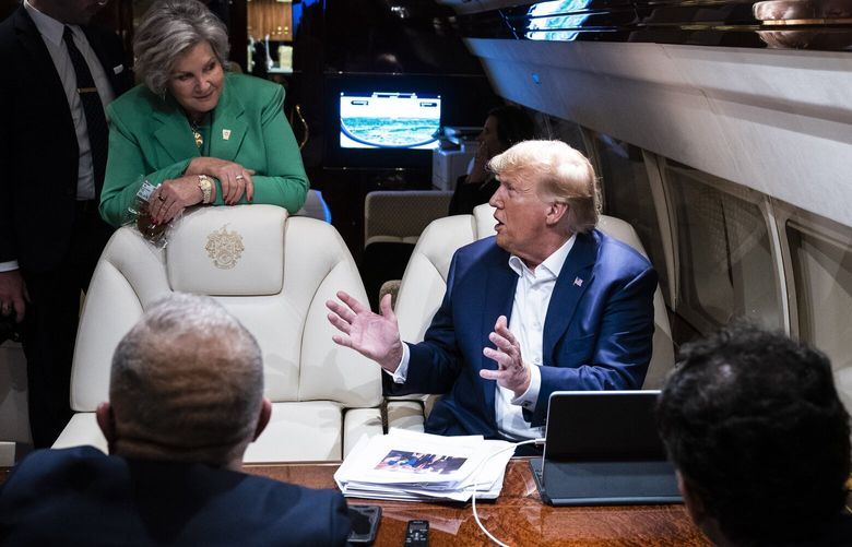 Campaign adviser Susie Wiles listens as former president Donald Trump speaks to staff and reporters aboard his plane, known as “Trump Force One.” MUST CREDIT: Jabin Botsford/The Washington Post