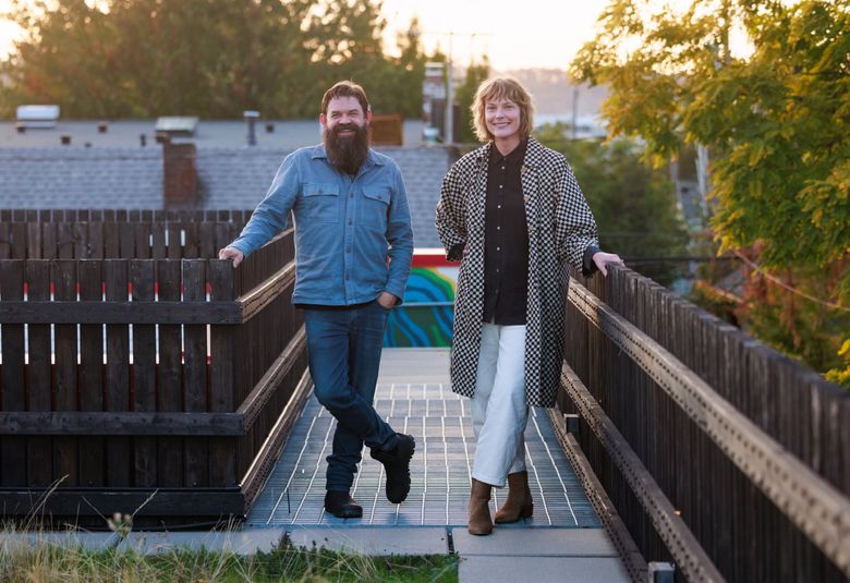 Artist and co-founder Ben Beres and incoming executive director Emily Kelly stand on top of Mini Mart City Park in Seattle’s Georgetown neighborhood. (Erika Schultz / The Seattle Times)