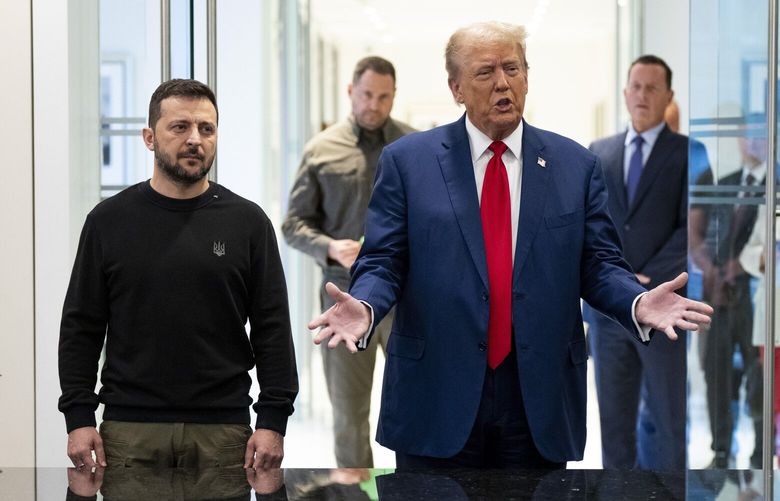 FILE — President Volodymyr Zelenskyy of Ukraine, left, listens as former President Donald Trump, the Republican nominee for president, speaks at Trump Tower in New York, Sept. 27, 2024. Trump blamed Zelensky of Ukraine for Russia’s invasion of his country in a podcast interview released on Thursday, Oct. 17, 2024, inverting the facts of the largest military action in Europe since the Second World War. The war began when President Vladimir Putin of Russia massed troops on the border and then invaded Ukraine, sending in troops and launching airstrikes on Feb. 24, 2022. (Doug Mills/The New York Times) XNYT0068 XNYT0068