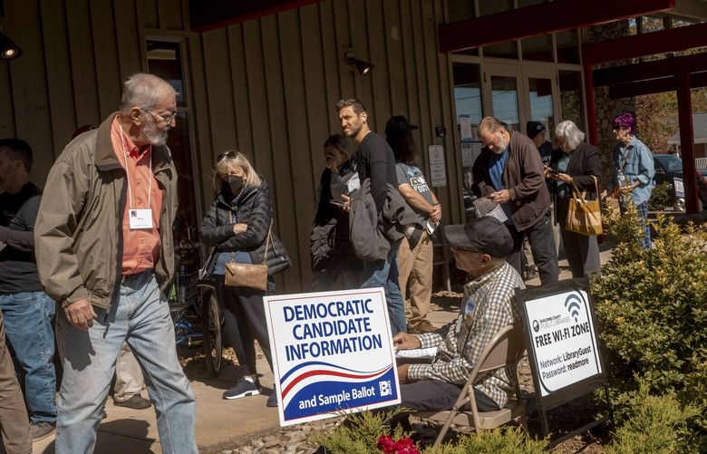 Voters line up on the first day of early voting at the public library in Black Mountain, N.C., Oct. 17, 2024. In interviews, most voters who showed at the library in Black Mountain, a purplish town in left-leaning Buncombe County, said they had long made up their minds about who to support. (Mike Belleme/The New York Times) XNYT0056 XNYT0056
