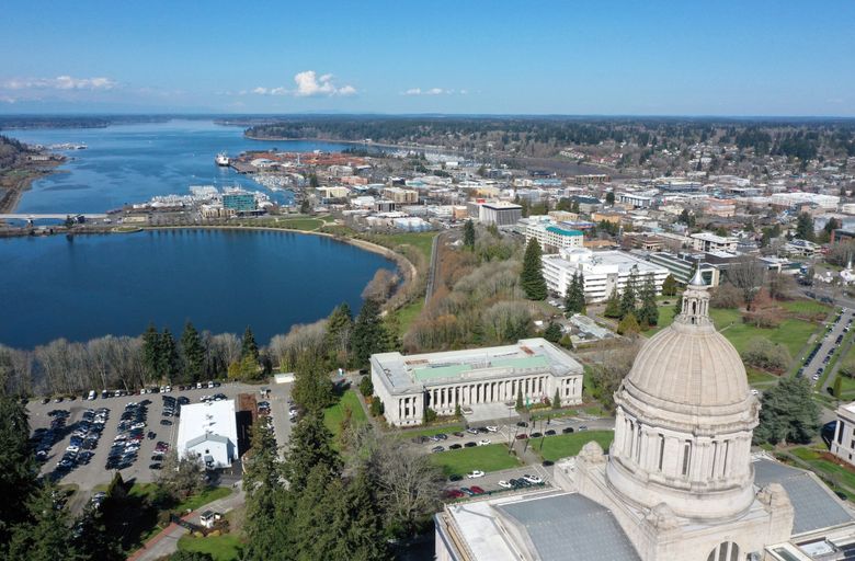 The Washington State Capitol looms over Olympia on March 22, 2023. (Karen Ducey / The Seattle Times)