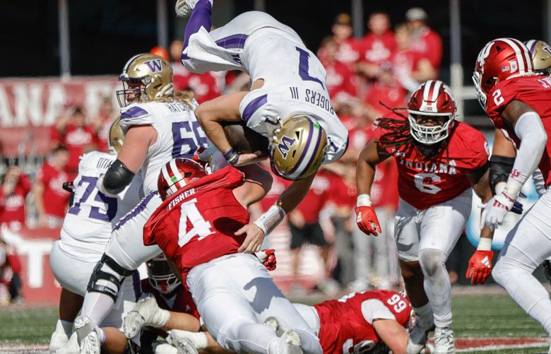 On 4th down and 3 in the second quarter, Will Rogers tries to make the first down run but is upended by Indiana linebacker Aiden Fisher short of the marker.  The Washington Huskies played the 13th-ranked Indiana Hoosiers Saturday, October 26, 2024 at Memorial Stadium, in Bloomington, IN. 228349