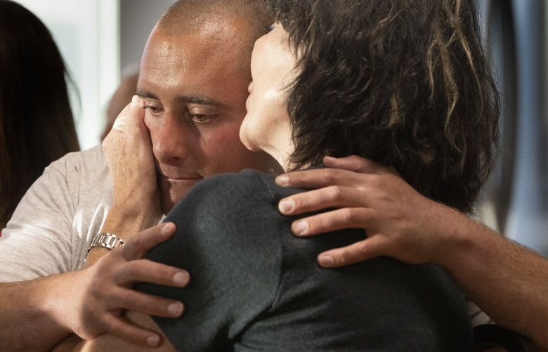 Joey Wilson, and his mother Mary Wilson,  hug after a showing in West Seattle of a documentary of his life by Bright-Eyed Entertainment August 1, 2024.             228236