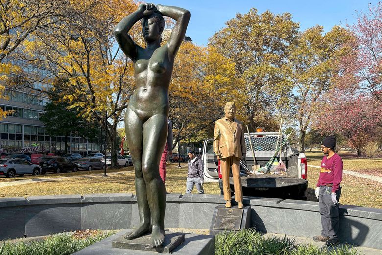 A statue of former President Donald Trump, emblazoned with a plaque titled “In honor of a lifetime of sexual assault,” popped up in Maja Park on Wednesday, Oct. 30, 2024, in Philadelphia. (Stephanie Farr/The Philadelphia Inquirer/TNS)