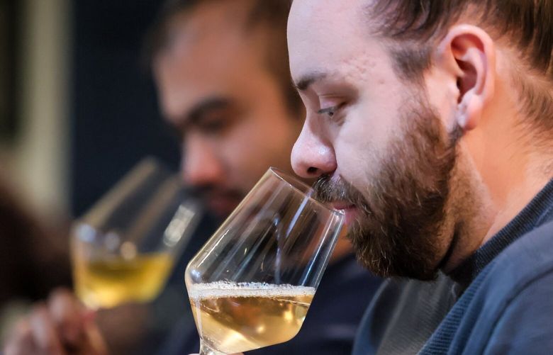 Dan Gervacio, left, and David Simpson during Wine Tasting Tuesdays at Surrell Restaurant in Seattle, Washington, on October 1, 2024.