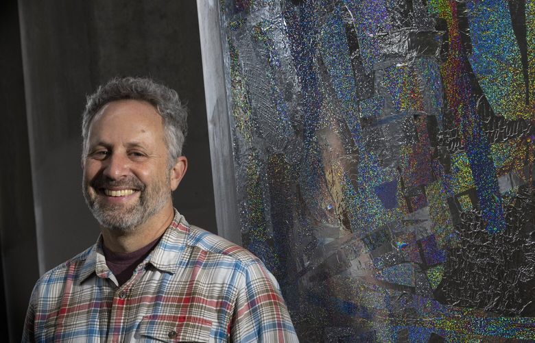 Artist Matthew Offenbacher stands near one of his seven pieces of art on display on seven different columns under I-5 at Colonnade Park located at 1701 Lakeview Blvd E. in Seattle Thursday, October 24, 2024.  The pop up exhibit will be on display through November 15.   For more information, see:  tinyurl.com/charms7. 228329