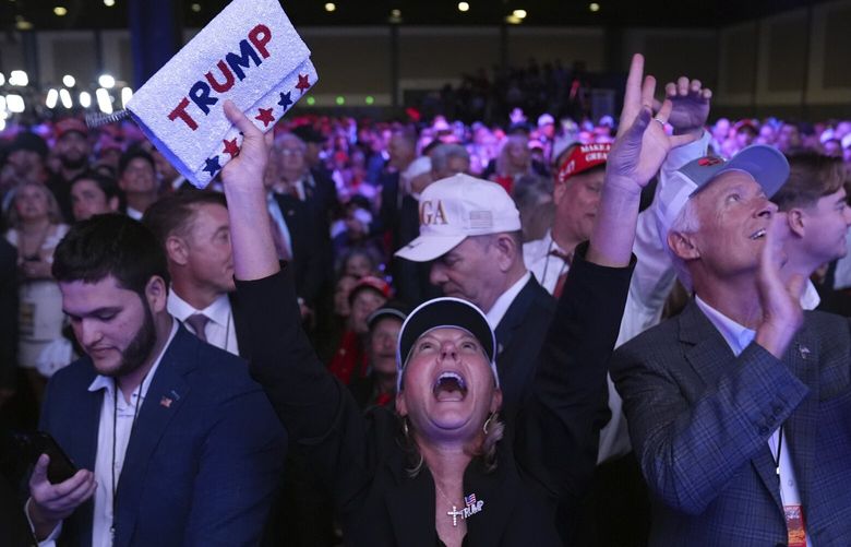 Supporters watch returns at a campaign election night watch party for Republican presidential nominee former President Donald Trump at the Palm Beach Convention Center, Wednesday, Nov. 6, 2024, in West Palm Beach, Fla. (AP Photo/Evan Vucci) FLJE400 FLJE400