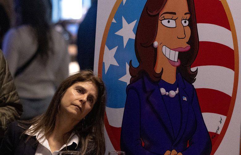 People watch as voting results are reported during an election watch party at Stoup Brewing in Capitol Hill on Tuesday, Nov. 5, 2024, in Seattle.