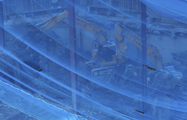 Demolition making way for Komatsu’s new headquarters in Tokyo on Nov. 7, 2024. The president-elect is again calling out companies by name in his campaign against what he sees as other countries’ unfair practices. (Chang W. Lee/The New York Times) 