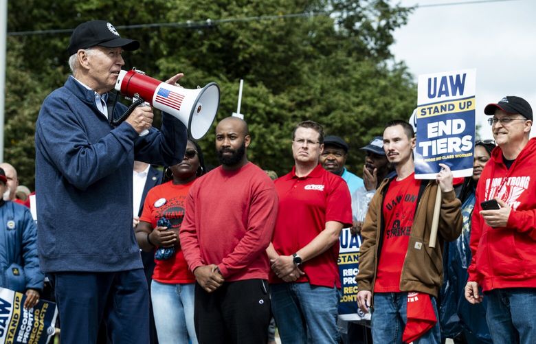 FILE – President Joe Biden joins striking United Auto Workers (UAW) members on a picket line outside a General Motors parts facility in Belleville, Mich., Sept. 26, 2024. After gains by organized labor under Biden, a second Trump administration is likely to change course on regulation and enforcement. (Pete Marovich/The New York Times)