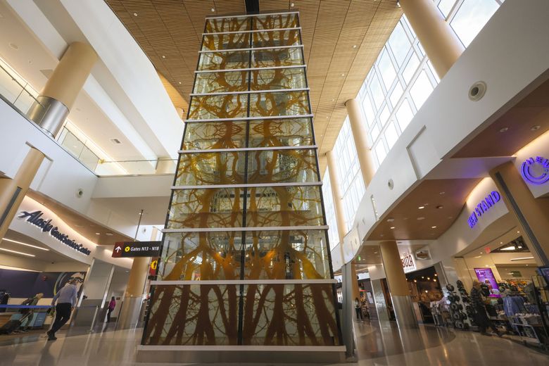 “Cathedral” by Jacqueline Metz and Nancy Chew which adorns a side of an elevator seen at Seattle–Tacoma International Airport. (Ivy Ceballo / The Seattle Times)