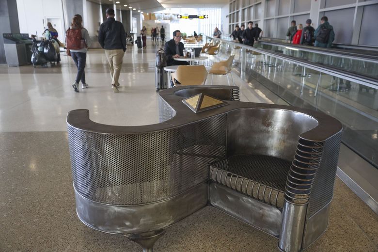 &#8220;Indiscrete&#8221; by Brian Swanson, designed for the French Salons of the 1860s, is pictured among seating at Seattle–Tacoma International Airport. (Ivy Ceballo / The Seattle Times)