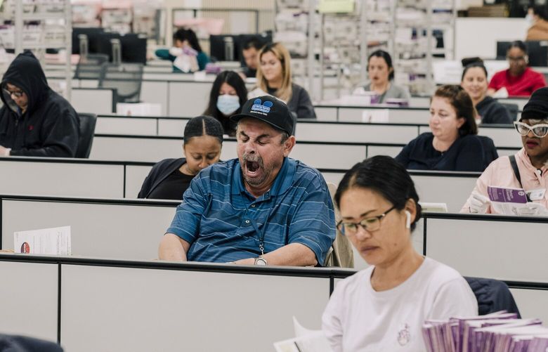 Election workers remove ballots from envelopes at a county building in City of Industry, Calif., on Nov. 9, 2024. California still had nearly five million votes to count going into the holiday weekend. (Mark Abramson/The New York Times) XNYT0862 XNYT0862