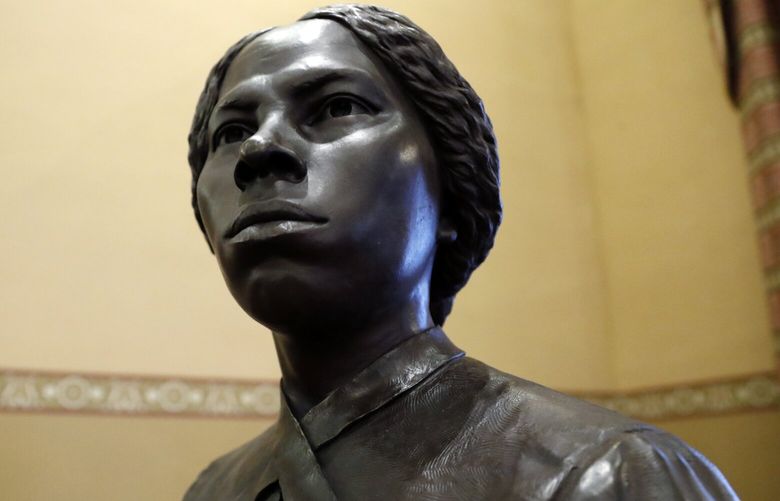FILE – A bronze statue of abolitionist Harriet Tubman is seen at the Maryland State House, Feb. 10, 2020, in Annapolis, Md. (AP Photo/Julio Cortez, file) NYPS203 NYPS203