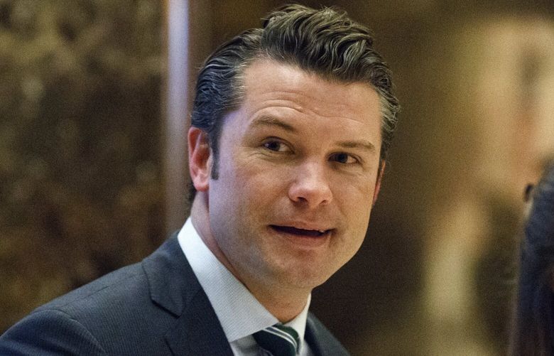 FILE – Pete Hegseth walks to an elevator for a meeting with President-elect Donald Trump at Trump Tower in New York, Dec. 15, 2016. (AP Photo/Evan Vucci, File) WX116 WX116