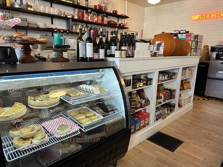 The Three Tree Point Store, nestled in an old craftsman-style home in Burien, is a neighborhood favorite for sandwiches, flatbreads, coffee and pantry goods. (Jackie Varriano / The Seattle Times)