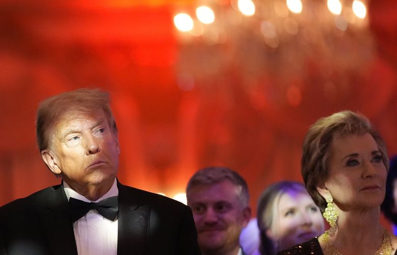 President-elect Donald Trump listens with Linda McMahon at right, during an America First Policy Institute gala at his Mar-a-Lago estate, Thursday, Nov. 14, 2024, in Palm Beach, Fla. (AP Photo/Alex Brandon) FLJE379 FLJE379