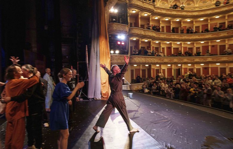 Actor Mykhailo Terschenko, second from left, acknowledges the audience at the end of the play “Shevchenko 2.0” at the Franko Theater in Kyiv, Ukraine, Nov. 11, 2024. (AP Photo/Evgeniy Maloletka) MAL539 MAL539