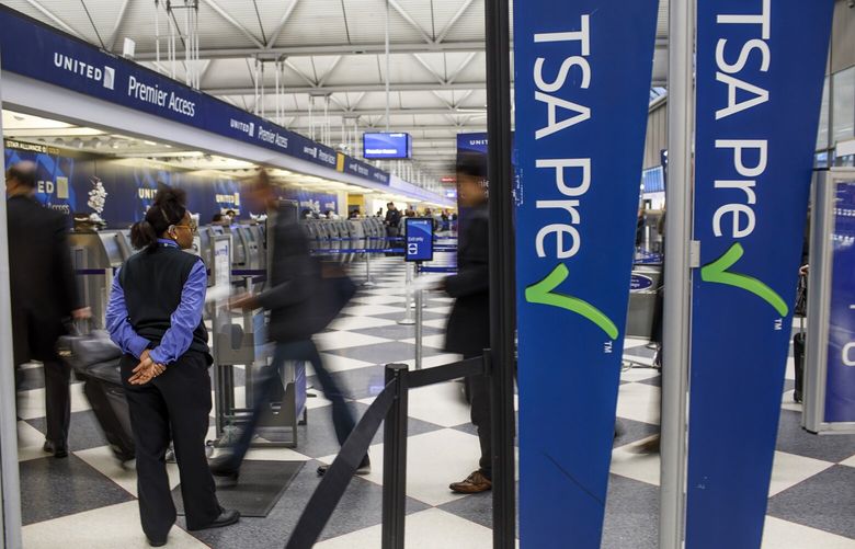 Passengers walk through the entrance of a TSA PreCheck in Terminal One at O’Hare International Airport Wednesday, Feb. 1, 2017, in Chicago. (Armando L. Sanchez/Chicago Tribune/TNS) 127476809W 127476809W