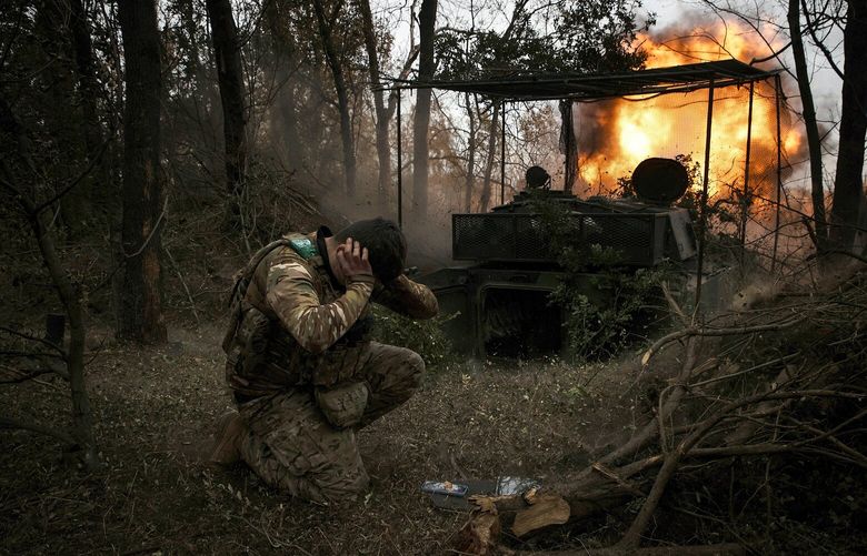An artillery unit of Ukraine’s 68th Jaeger Brigade fires at Russian positions outside a town in the Donbas region on Oct. 13, 2024. As the war in Ukraine enters its fourth winter, the situation is growing tougher for overextended Ukrainian forces facing a Russian military willing to absorb staggering casualties. (Tyler Hicks/The New York Times) XNYT0304 XNYT0304