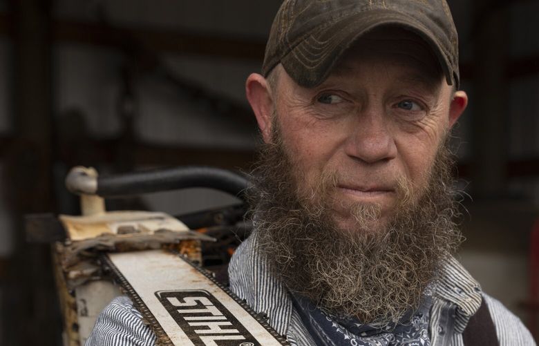 Dennis Root, who has been in the logging industry for more than 30 years and is currently working as a hooktender for his logging crew, in Yamhill County, Ore., Nov. 15, 2024. In 1990, 11,000 Oregonians worked in the logging industry, including those who take down trees and drive trucks – a figure that had dropped to 4,400 by 2024, according to federal data. (Kristina Barker/The New York Times)