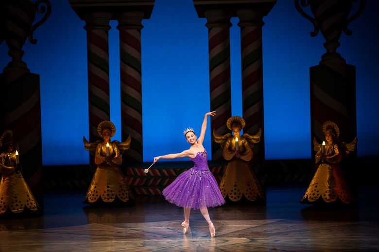 Pacific Northwest Ballet principal dancer Sarah-Gabrielle Ryan and PNB school students dance on stage in George Balanchine’s "The Nutcracker."