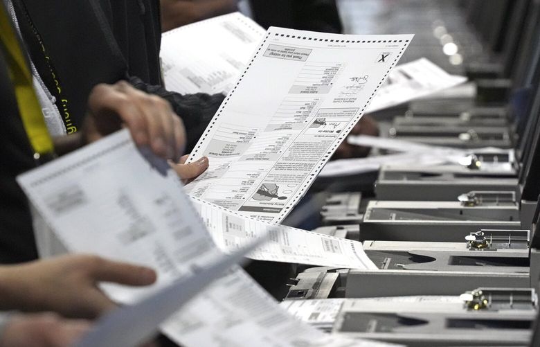 FILE – Election workers recount ballots from the recent Pennsylvania Senate race at the Allegheny County Election Division warehouse on the Northside of Pittsburgh, Wednesday, Nov. 20, 2024. (AP Photo/Gene J. Puskar, File) PAGP102 PAGP102