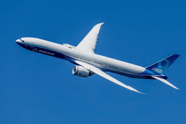 A Boeing 777X flies above Seafair on Aug. 4 in Seattle. (Jennifer Buchanan / The Seattle Times)