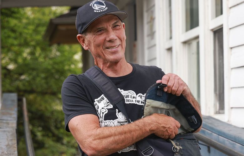 Johnny Ohta, who is a substance use disorder professional at Ryther, leaves the University District Youth Center in Seattle to continue his workday on Monday, July 29, 2024. 


 227597