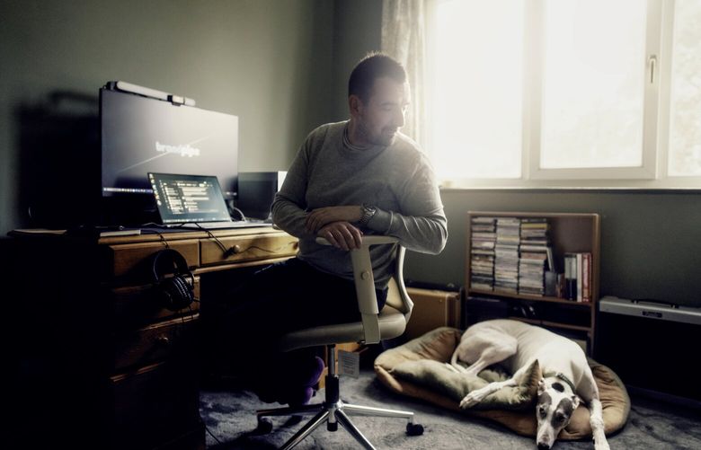 Matt Kimber, a senior engineer at the software company BrandPipe, which is testing a four-day workweek, at his home office in East London, Nov. 14, 2024. The company is one of several British businesses testing a four-day workweek with no reduction in pay, part of a six-month trial involving about 1,000 workers organized by the advocacy group 4 Day Week. (Tom Jamieson / The New York Times)