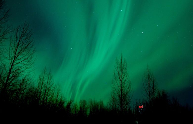 FILE – This Jan. 23, 2012 file photo shows the aurora borealis, or Northern Lights, near the city of Talkeetna, Alaska. This year and next year are expected to offer prime viewing for the northern lights due to a peak in the cycle of solar activity that causes the lights. The Fairbanks region of Alaska is gearing up for increased tourism as visitors flock to see the colorful but elusive phenomenon. (AP Photo/Michael Dinneen, file) NYET784