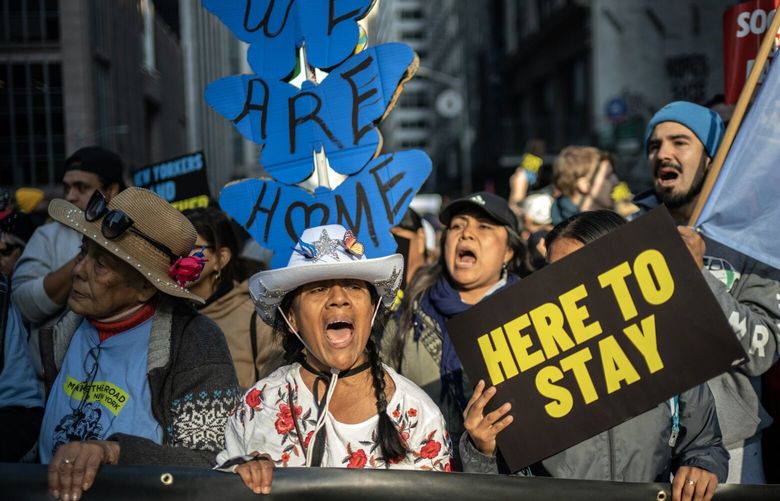 FILE — Demonstrators march to show support for immigrant families in New York, Nov. 9, 2024. As President-elect Donald Trump promises to deport millions of undocumented immigrants, Democratic governors are bracing themselves to be on the front lines of an emotional and politically explosive battle against his administration. (Victor J. Blue/The New York Times) XNYT0849 XNYT0849