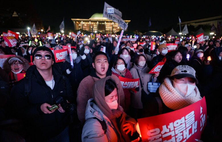 Demonstrators call for the impeachment of President Yoon Suk Yeol outside the National Assembly in Seoul, Dec. 7, 2024. The President’s attempt to suspend the democratic system has given rise to a new group of politically active South Koreans. (Chang W. Lee/The New York Times)

 XNYT0344 XNYT0344