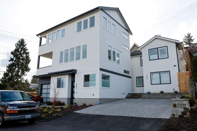 This new three-home development in Northeast Seattle includes a main house, an attached accessory dwelling unit and a detached accessory dwelling unit. (Jennifer Buchanan / The Seattle Times)