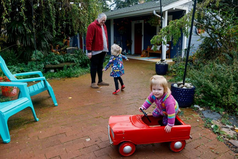 Grandma Patricia Blakely sold her house in Duvall and used the proceeds to build an accessory dwelling unit on her daughter and son-in-law’s Shoreline property. She helps care for 3-year-old Juniper and 1-year-old Rowan.
(Jennifer Buchanan / The Seattle Times)