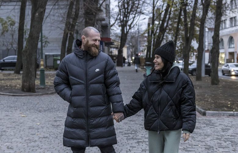 **EMBARGO: No electronic distribution, Web posting or street sales before FRIDAY 12:01 A.M. ET, DEC. 13, 2024. No exceptions for any reasons. EMBARGO set by source.** Damina Serbyn and Roman Myronenko, a deputy commander of a frontline drone battalion, in Kharkiv, Ukraine, Nov. 16, 2024. When she is away, he does not feel like he is truly living, he said. (Oksana Parafeniuk/The New York Times) XNYT0518 XNYT0518