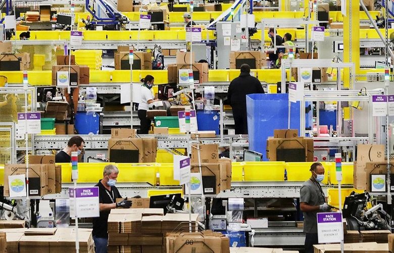 An Amazon fulfillment center in Kent in 2020. A Senate committee report found that Amazon executives rejected recommendations to ease enforcement of production quotas. (Ken Lambert / The Seattle Times)