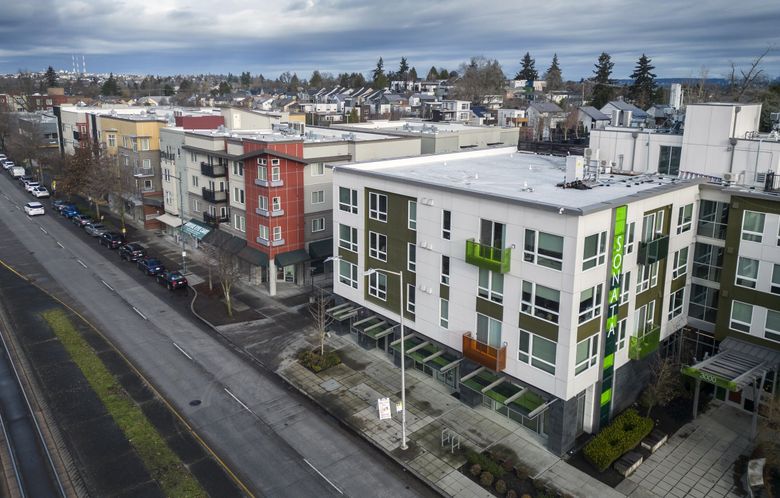 Apartments at Martin Luther King Jr. South and South Alaska Street are a short walk from the Columbia City light rail station. (Ellen M. Banner / The Seattle Times)