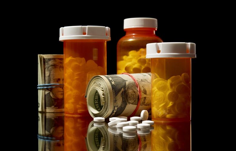 An illustrative photo of prescription medications and rolls of cash, Dec. 5, 2024. A New York Times investigation details how pharmacy benefit managers, or PBMs, took billions of dollars from opioid manufacturers in return for not restricting painkiller prescriptions, as tens of thousands of Americans overdosed and died. (Jens Mortensen / The New York Times)