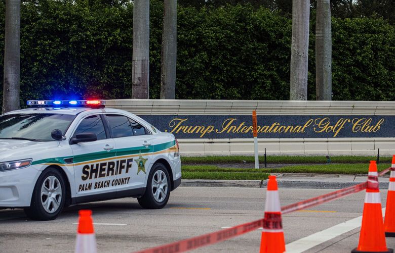 FILE — Police outside the Trump International Golf Club in West Palm Beach, Fla., after an apparent attempted assassination of former President Donald Trump, the Republican nominee for president, Sept. 15, 2024. Florida officials filed charges on Wednesday, Dec. 18, 2024, against the man accused of trying to assassinate President-elect Donald Trump at his West Palm Beach golf course in September, defying federal prosecutors who had asked the state to suspend its investigation while their own moved forward. (Saul Martinez/The New York Times) XNYT0027 XNYT0027