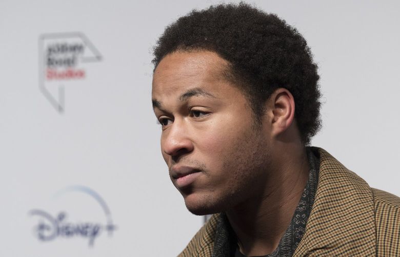 Sheku Kanneh-Mason poses for photographers upon arrival for the premiere of the film ‘If These Walls Could Sing’ in London, Monday, Dec. 12, 2022. (Photo by Scott Garfitt/Invision/AP)