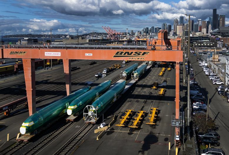 737 Max fuselages heading to Renton are stored on train cars in a Sodo railyard in October. (Ken Lambert / The Seattle Times)