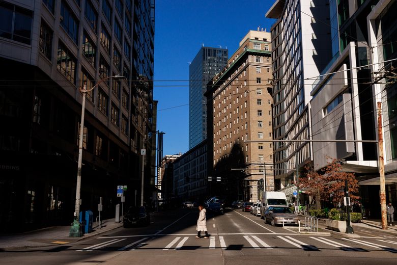 New census figures show Seattle is the remote work capital of America. But we aren’t acting like it in our efforts to save a depleted downtown. Here, a pedestrian walks on Second Avenue. (Erika Schultz / The Seattle Times, 2022)