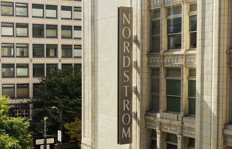 Pedestrians walk past Nordstrom in downtown Seattle on  Sept. 4, 2024.  (Erika Schultz / The Seattle Times)