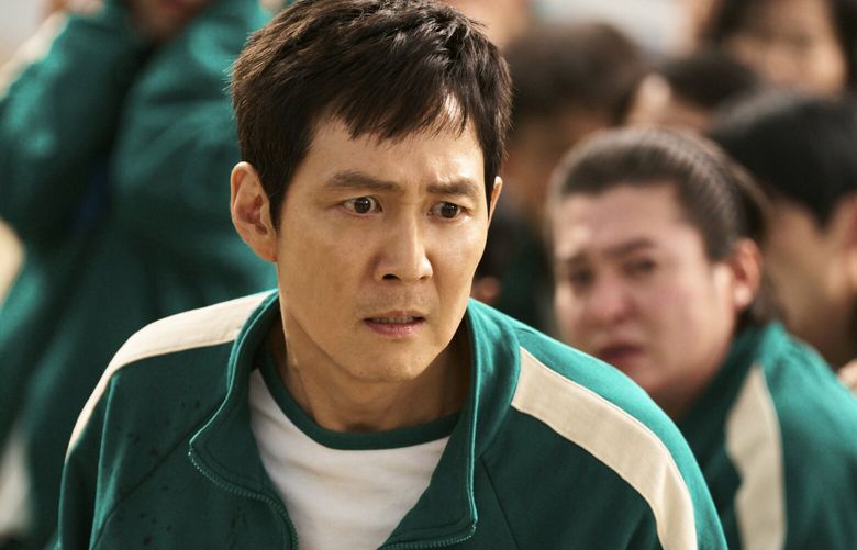 This image released by Netflix shows Lee Jung-jae in a scene from “Squid Game.” (No Ju-han/Netflix via AP) NYET502 NYET502