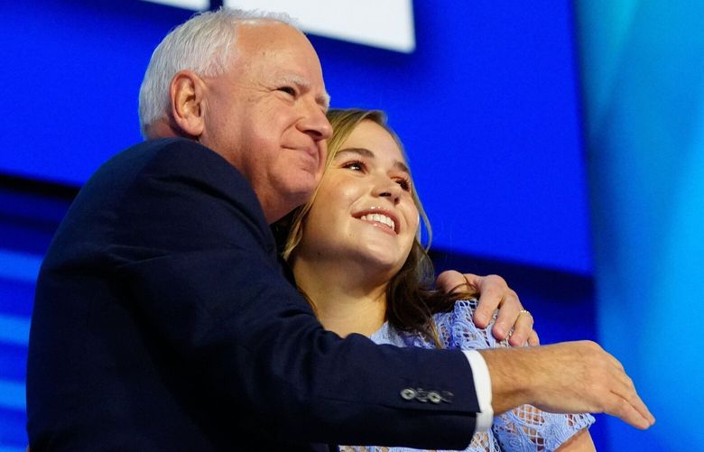 Minnesota Gov. Tim Walz (D) hugs his daughter, Hope Walz, after his speech during the Democratic National Convention on Aug. 21 in Chicago. MUST CREDIT: Melina Mara/The Washington Post